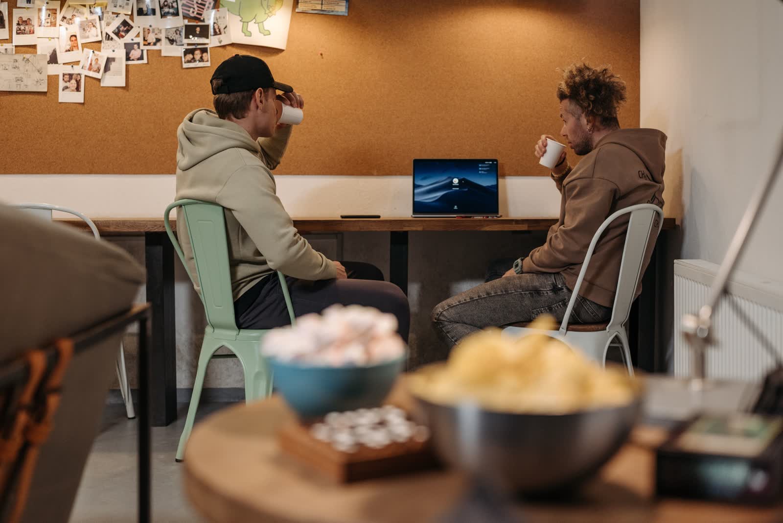 Two people talking over coffee